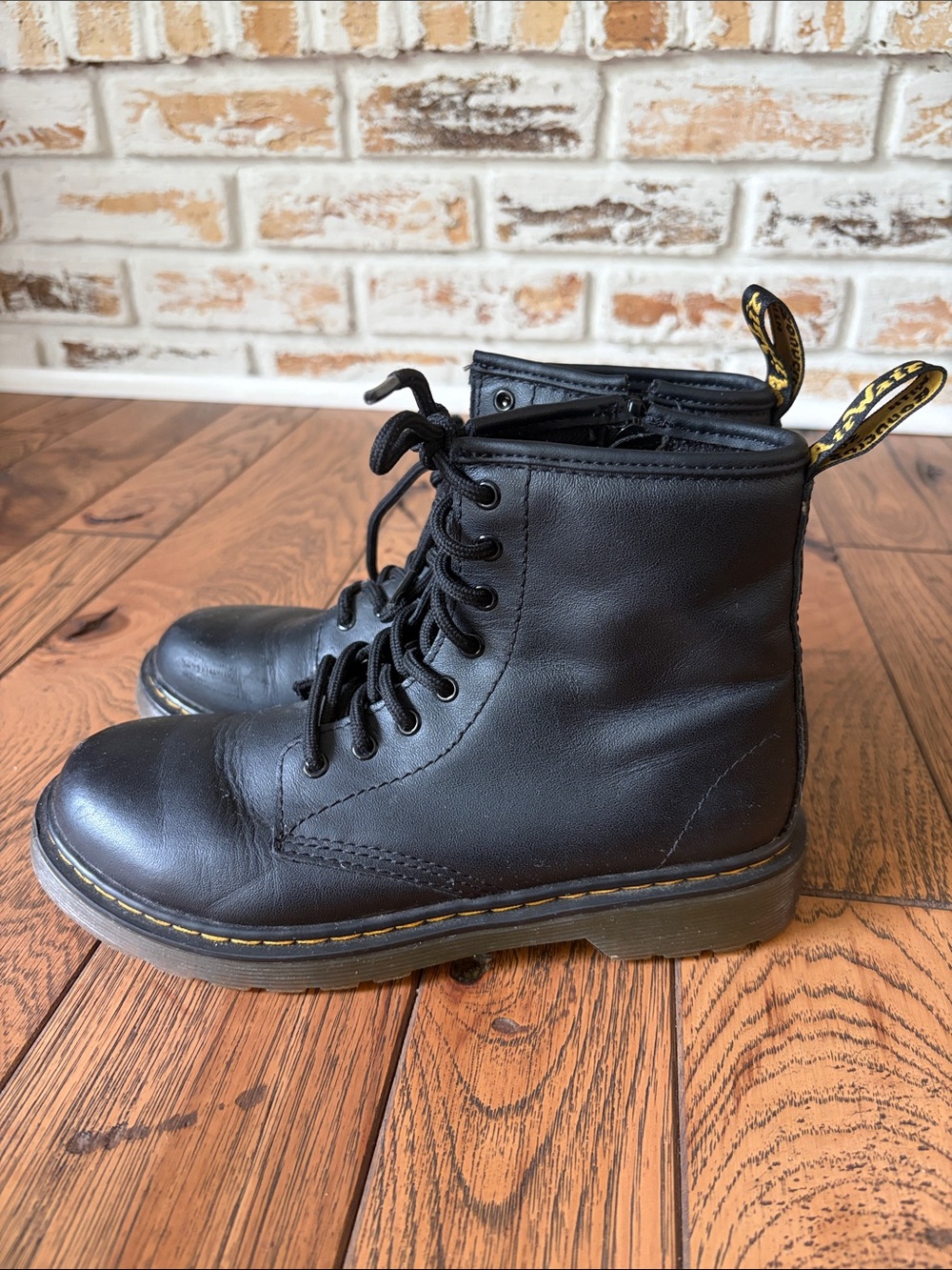 Dr. Martens Black Leather Lace-Up Combat Boots with Yellow Heel Tabs